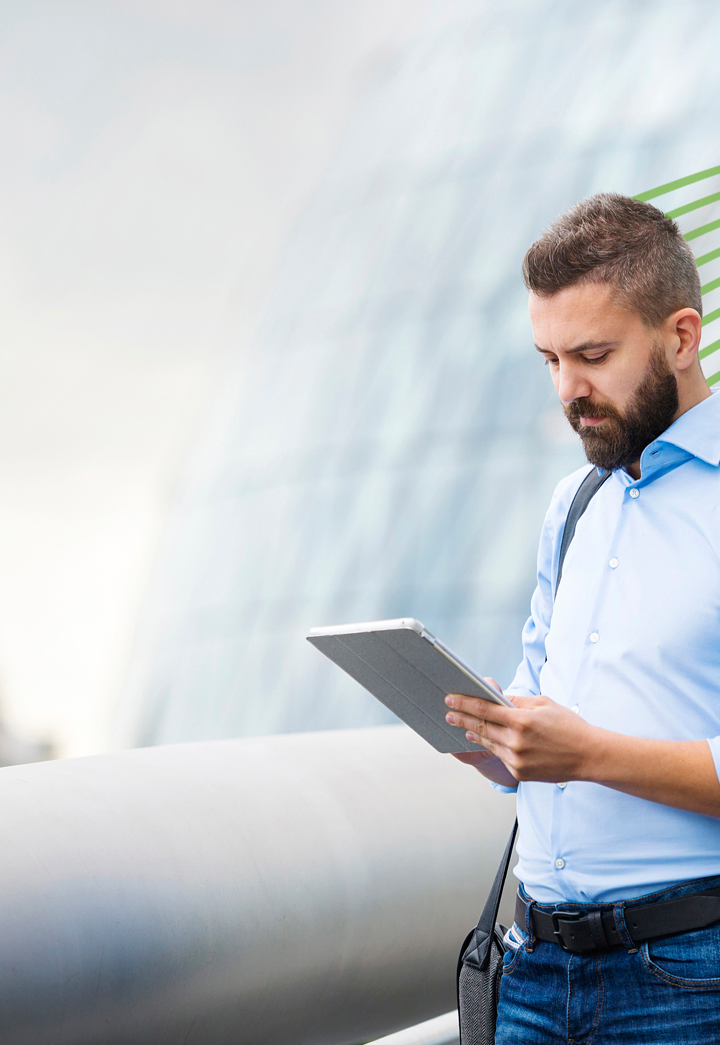 Handsome young man with tablet in the streets of London