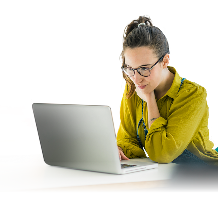 Shot of two young coworkers using a laptop during a late night at work