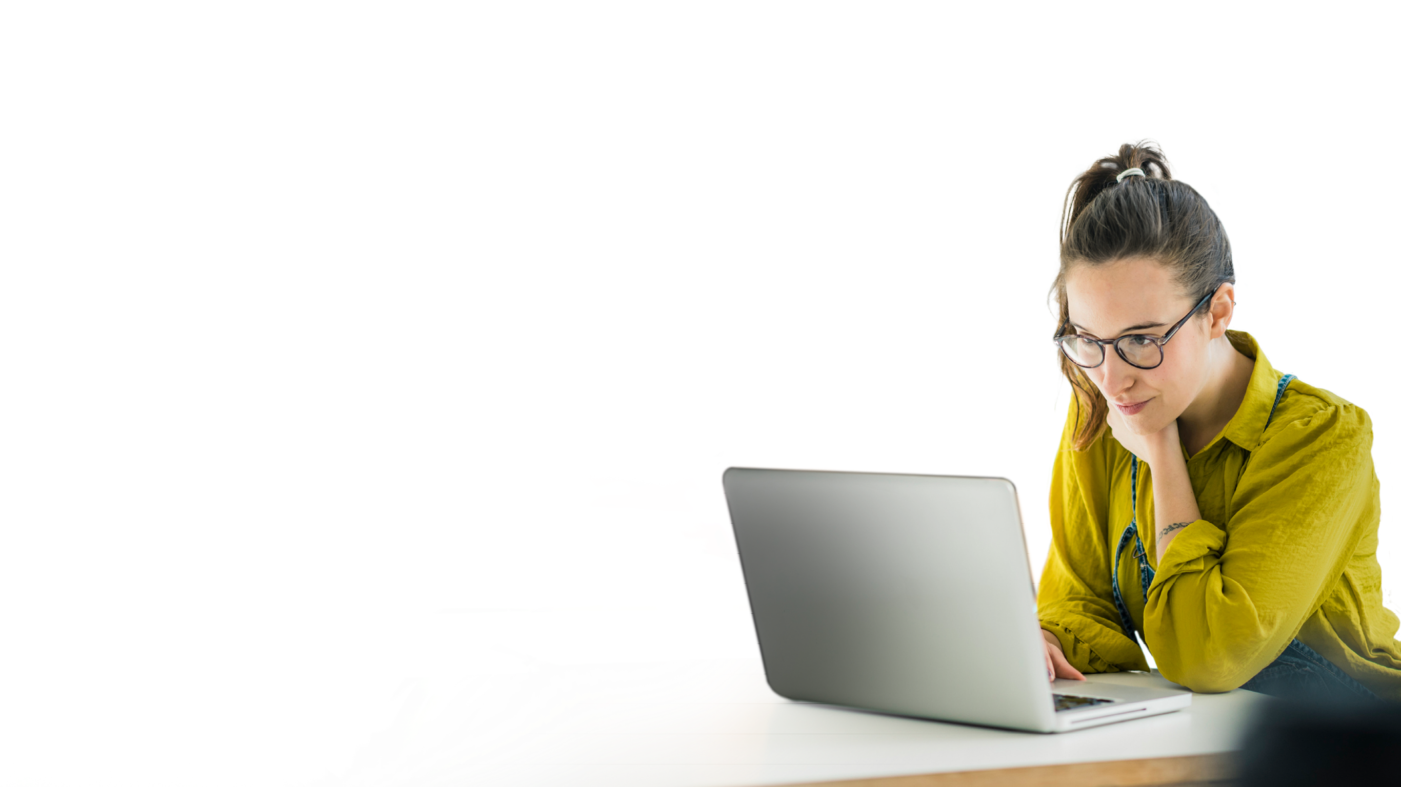 Shot of two young coworkers using a laptop during a late night at work