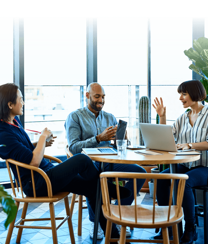 Hispanic businesswoman sitting around table with male colleagues, confidence, leadership, friendship