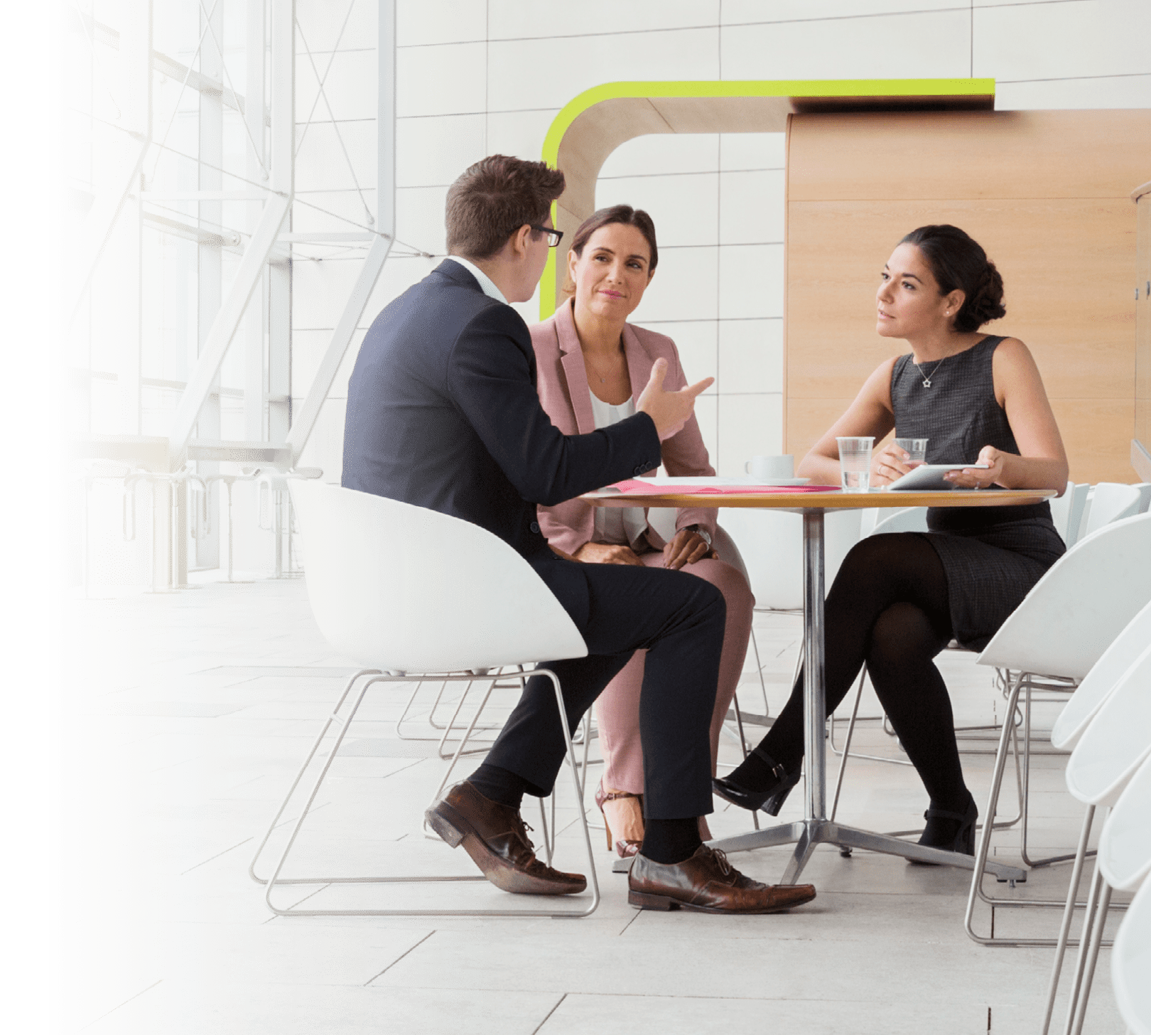 Business people having meeting in modern lobby
